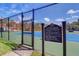 Community tennis court with clear rules, offering residents a recreational space for active living at 2755 Via Capri # 1223, Clearwater, FL 33764