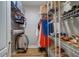 Organized walk-in closet with shelving and hanging space, providing ample storage for clothes and accessories at 2755 Via Capri # 1223, Clearwater, FL 33764