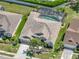 Stunning aerial view of home with screened pool, lush lawn and landscaping and neutral colored roof at 2908 89Th E Ave, Parrish, FL 34219