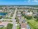 Expansive aerial view of a residential neighborhood featuring well-maintained homes and lush green spaces, showcasing community living at 2908 89Th E Ave, Parrish, FL 34219