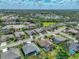 Picturesque aerial view of a residential area, highlighting the blend of manicured lawns and mature trees, promoting a nature-filled lifestyle at 2908 89Th E Ave, Parrish, FL 34219