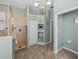 Relaxing bathroom area with tiled shower, nautical décor, corner shelves and muted color palette at 2908 89Th E Ave, Parrish, FL 34219