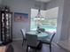 Cozy breakfast nook features a large window overlooking the screened pool at 2908 89Th E Ave, Parrish, FL 34219