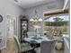 Bright breakfast nook features a large window overlooking the screened pool at 2908 89Th E Ave, Parrish, FL 34219