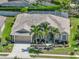 Charming home showcasing a manicured front yard, tropical landscaping, and an attached two-car garage at 2908 89Th E Ave, Parrish, FL 34219