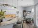 Bright eat-in kitchen features white cabinets, granite countertops, and decorative shelving at 2908 89Th E Ave, Parrish, FL 34219