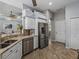 Updated kitchen featuring stainless steel appliances, granite counters, and a breakfast bar at 2908 89Th E Ave, Parrish, FL 34219