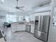 Bright kitchen featuring stainless steel refrigerator and adjacent breakfast nook at 2908 89Th E Ave, Parrish, FL 34219