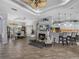 Spacious living area with a fireplace, breakfast bar, and open layout to the dining area at 2908 89Th E Ave, Parrish, FL 34219