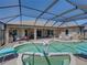 Enjoy a private screened-in pool, perfect for relaxation and entertaining with great views at 2908 89Th E Ave, Parrish, FL 34219