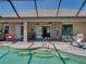Lanai features a sparkling pool surrounded by seating and access to indoor living spaces at 2908 89Th E Ave, Parrish, FL 34219