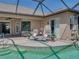 Relaxing outdoor patio featuring cushioned lounge chairs next to a pristine pool at 2908 89Th E Ave, Parrish, FL 34219