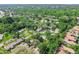 An aerial view capturing the community with lush tree coverage, offering privacy and a natural setting at 2953 Yucca Ct, Palm Harbor, FL 34684