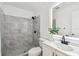 Modern bathroom with updated vanity, a frameless glass shower, and elegant tile work at 2953 Yucca Ct, Palm Harbor, FL 34684