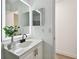 Well-lit bathroom featuring a modern vanity with ample storage and stylish fixtures at 2953 Yucca Ct, Palm Harbor, FL 34684