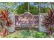 Strathmore Gate East: A deed-restricted community sign amid lush greenery at 2953 Yucca Ct, Palm Harbor, FL 34684