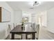 Dining room with a view of the kitchen and modern lighting fixtures at 2953 Yucca Ct, Palm Harbor, FL 34684