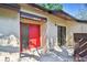 Well-maintained front entrance with a vibrant red door and tiled patio at 2953 Yucca Ct, Palm Harbor, FL 34684
