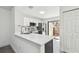 Bright kitchen with white countertops, stainless steel appliances, and easy access to the fenced patio at 2953 Yucca Ct, Palm Harbor, FL 34684