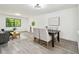 Open-plan living and dining area with ample natural light and modern decor, with view of window at 2953 Yucca Ct, Palm Harbor, FL 34684