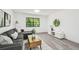Comfortable living room with large windows and neutral decor, perfect for relaxation at 2953 Yucca Ct, Palm Harbor, FL 34684