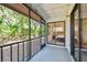 Screened-in patio with views of the lush greenery and privacy, accessed by a sliding glass door at 2953 Yucca Ct, Palm Harbor, FL 34684