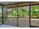 Screened-in patio offers a view of the lush, green backyard at 2953 Yucca Ct, Palm Harbor, FL 34684