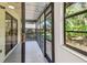 The screened-in porch has plenty of space to relax with views of the yard at 2953 Yucca Ct, Palm Harbor, FL 34684