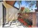 Exterior patio area with a door, brown accent fence and landscaping at 2953 Yucca Ct, Palm Harbor, FL 34684