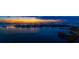 Expansive aerial view of waterfront homes at sunset with docks on a bay at 4 Belleview Blvd # 802, Belleair, FL 33756