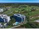 Aerial view of building with a pool and golf course in a beautiful waterfront location at 4 Belleview Blvd # 802, Belleair, FL 33756