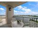 A balcony overlooking the bay with an outdoor table and chairs at 4 Belleview Blvd # 802, Belleair, FL 33756