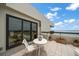 Balcony with tile floors and glass railings, offering stunning views of the surrounding area at 4 Belleview Blvd # 802, Belleair, FL 33756