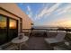 Balcony with tile floors and glass railings, offering stunning views of the surrounding area at sunset at 4 Belleview Blvd # 802, Belleair, FL 33756