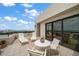 Relaxing balcony with outdoor seating and panoramic views of the city skyline and bay at 4 Belleview Blvd # 802, Belleair, FL 33756