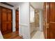 Cozy bathroom with white vanity, shower/tub, and floral wallpaper at 4 Belleview Blvd # 802, Belleair, FL 33756