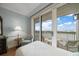 Bedroom with balcony access offers sweeping views and comfortable seating at 4 Belleview Blvd # 802, Belleair, FL 33756