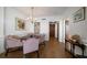 Cozy dining area with a round table, decorative chairs, chandelier, and hardwood floors at 4 Belleview Blvd # 802, Belleair, FL 33756