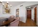 Stylish dining area with a round table, decorative chairs, chandelier, and hardwood floors at 4 Belleview Blvd # 802, Belleair, FL 33756