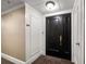 Front entrance with black door in condo or apartment hallway at 4 Belleview Blvd # 802, Belleair, FL 33756