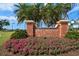 Belleair Country Club entrance sign with lush flowers and landscaping at 4 Belleview Blvd # 802, Belleair, FL 33756