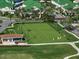 Aerial view of a manicured golf green, showcasing the putting surface and surrounding landscape at 4 Belleview Blvd # 802, Belleair, FL 33756