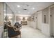 Hallway with seating areas, decorative lighting, a mirror, and easy access to the elevator at 4 Belleview Blvd # 802, Belleair, FL 33756