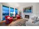 Charming living room with a fireplace, bright decor and stunning views at 4 Belleview Blvd # 802, Belleair, FL 33756