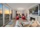 A sunny living room with a view leading out to a balcony at 4 Belleview Blvd # 802, Belleair, FL 33756