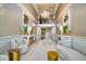 Beautifully decorated lobby with seating, plants, chandelier and elevator access for residents and guests at 4 Belleview Blvd # 802, Belleair, FL 33756