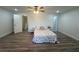 Bright bedroom features modern wood-look flooring, neutral colored walls, and minimal furniture at 4022 Cortez Dr # A, Tampa, FL 33614