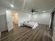 Bright bedroom featuring hardwood floors, ceiling fan and walkout to the balcony at 4022 Cortez Dr # A, Tampa, FL 33614