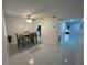 Bright dining room with modern tile flooring and a view to the kitchen at 4022 Cortez Dr # A, Tampa, FL 33614