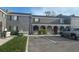 Exterior view of a gray two-story building with parking in front of the complex at 4022 Cortez Dr # A, Tampa, FL 33614